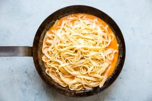 bang bang pasta in a pan with creamy sauce