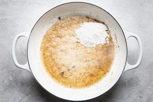 gravy being made in a skillet with butter and flour