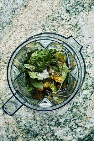 garlic, lemon zest, lemon Juice, basil, olive oil, sugar, salt and pepper in a blender to make homemade basil vinaigrette