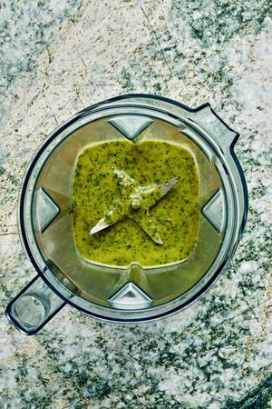 homemade basil vinaigrette in a blender made with garlic, lemon zest & Juice, basil, olive oil, sugar, salt and pepper