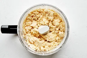 flour, salt, butter, eggs and ice water in a food processor to make homemade flaky empanada dough