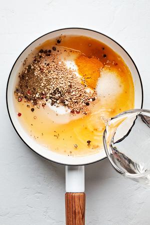 crushed spices, vinegar, water,  turmeric, sugar, and salt in a medium saucepan