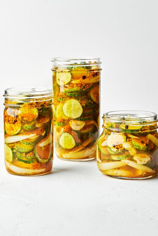 3 glass jars filled with homemade bread and butter pickles