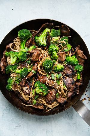 Broccoli beef soba noodles in a sauce pan
