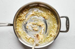 shallot, garlic, butter and flour being cooked in a skillet
