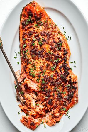 broiled salmon seasoned with olive oil, brown sugar, salt, paprika, garlic powder, onion powder, pepper, and mustard