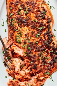 broiled salmon seasoned with olive oil, brown sugar, salt, paprika, garlic powder, onion powder, pepper, and mustard