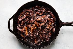 beef bulgogi being cooked in a skillet