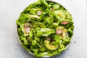 boston lettuce salad with avocado, chives, radishes and a honey dijon mustard vinaigrette