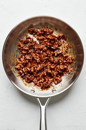 walnuts, brown sugar, butter, salt and cayenne cooking in a skillet