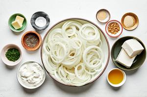 olive oil, butter, onions, brown sugar, cream cheese, sour cream, spices and chives in prep bowls