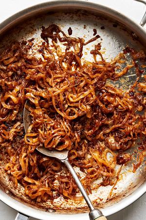 caramelized onions in a skillet made with olive oil, butter and brown sugar