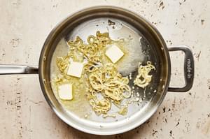 sliced shallots, garlic and butter in a skillet