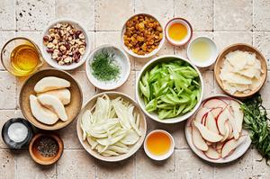 celery, fennel, pears, hazelnut, Parmesan, golden raisings, tarragon and fennel in prep bowls
