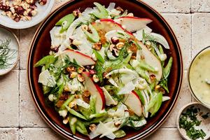 celery pear and hazelnut salad topped with Parmesan and pear vinaigrette