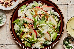 celery pear and hazelnut salad topped with Parmesan and pear vinaigrette