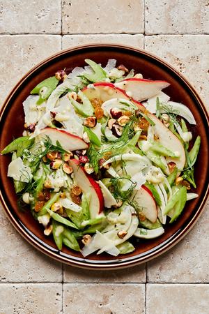 celery pear and hazelnut salad topped with Parmesan and pear vinaigrette