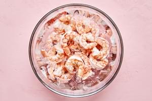 boiled shrimp cooling in a bowl of ice water