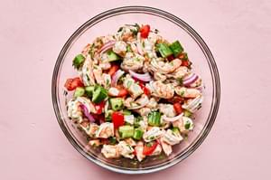 shrimp, lime zest, lime juice, tomatoes, cucumber, red onion, cilantro, salt, sugar, pepper, garlic powder & cumin in a bowl
