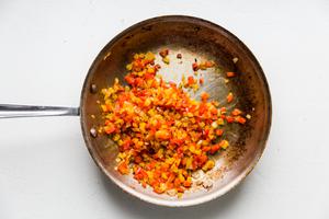 minced Onion, Bell peppers and garlic in olive oil in a skillet