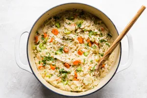 creamy orzo chicken in a soup pot