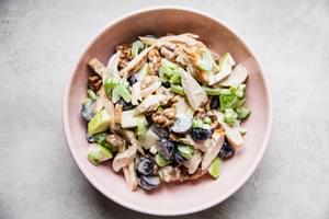 chicken waldorf salad in a bowl with grapes, apples and celery