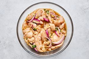 chicken marinating in pineapple, lime zest & juice, spices, vinegar, jalapeño, Worcestershire, cilantro & onion