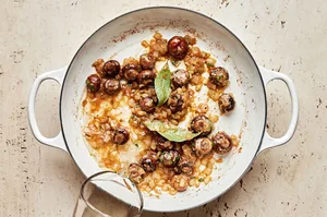 mushrooms, onion, garlic, thyme, bay leaves, and nutmeg cooking in a pot
