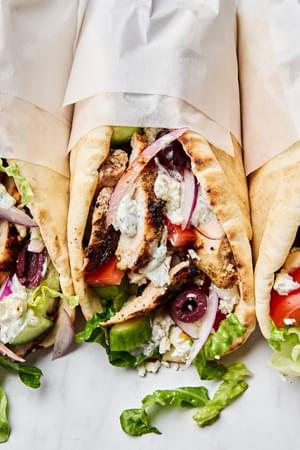 chicken gyros wrapped in pita and parchment paper