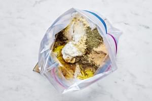 Chicken thighs, Greek yogurt, and spices in a zip top bag for Chicken Gyros