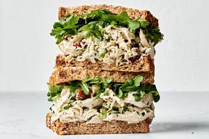 homemade chicken salad  sandwich with celery and pecans with arugula