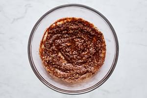 orange juice, lime juice, garlic, chili powder, onion powder, paprika, salt, and pepper stirred together in a bowl