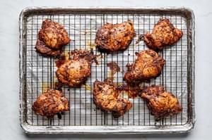 baked chicken thighs seasoned with orange juice, lime juice, garlic, chili powder, onion powder, paprika, salt, and pepper