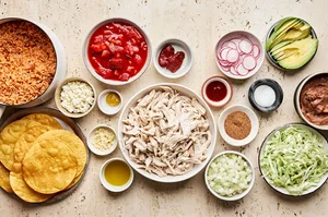 ingredients laid out to make chicken tinga that will be used to serve chicken tinga tacos