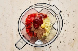 tomatoes, chipotle peppers, onions, garlic and spices in a blender to make smoky tinga sauce