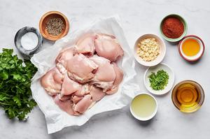 chicken thighs, cilantro, lime juice, lime zest, honey, olive oil & spices in prep bowls