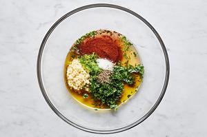 olive oil, garlic, honey, lime zest, lime juice, cilantro, chili powder, salt, and pepper. in a glass bowl