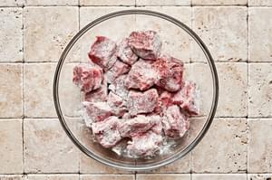 chuck roast cut in to 2 inch pieces tossed with salt, pepper and flour in a glass bowl