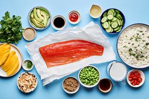salmon, coconut rice, cucumber, avocado, mango, edamame, fish sauce, sriracha, brown sugar, coconut milk & soy sauce in bowls