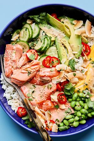 Coconut Rice Salmon Bowl, mango, cucumber, avocado, edamame, cilantro, toasted coconut, sesame seeds and Fresno pepper.