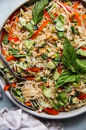 ramen noodle salad in a bowl with a serving spoon
