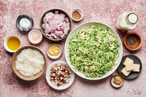 brussels sprouts, shallots, parmesan, cream, hazelnuts, butter, salt, pepper, nutmeg, garlic & stone ground mustard in bowls