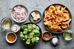 chanterelle mushrooms, Brussels sprouts, shallots, butter, salt, pepper, cream, white wine and olive oil in prep bowls
