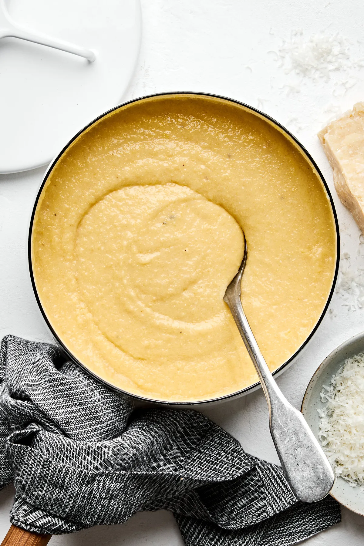 a bowl of homemade polenta made with milk, chicken stock, butter, salt, pepper and Parmesan