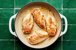 four boneless skinless chicken breasts browned in a large skillet