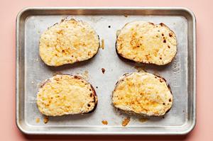 croque madame sandwiches on a baking sheet made with ham, Gruyère and homemade Béchamel sauce