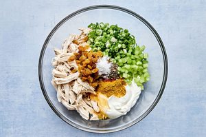 celery, scallions, golden raisins, greek yogurt, lemon juice, honey, spices and chicken in a large bowl
