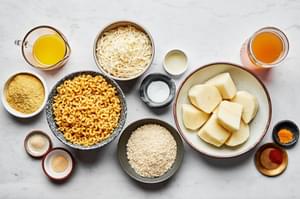 potatoes, pasta, chicken stock, nutritional yeast, vegan cheese, spices, vegan butter, lemon juice and panko in prep bowls