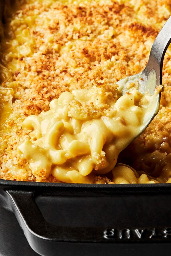 baked dairy free mac and cheese topped with panko bread crumbs in a 9x13 baking dish