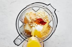 stock, vegan cheese shreds, nutritional yeast, spices, lemon juice, vegan butter and boiled potatoes in a blender